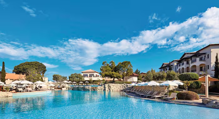 Lagoon-style pool and landscaped grounds at TUI BLUE Sensatori Atlantica Aphrodite Hills in Cyprus
